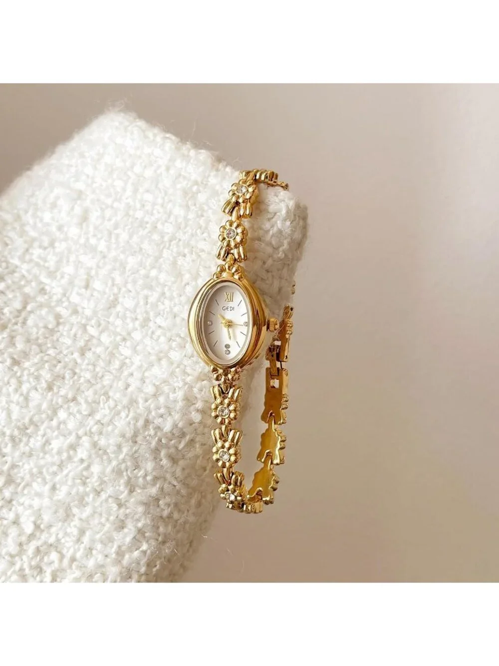 Women Gold And White Analog Quartz Alloy Steel Oval Roman Numeral Bracelet Watch